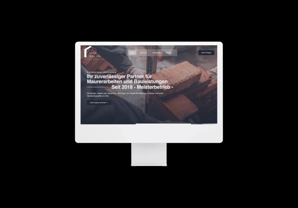 Website of Tülü Bau, a partner for masonry and construction work, on a monitor
